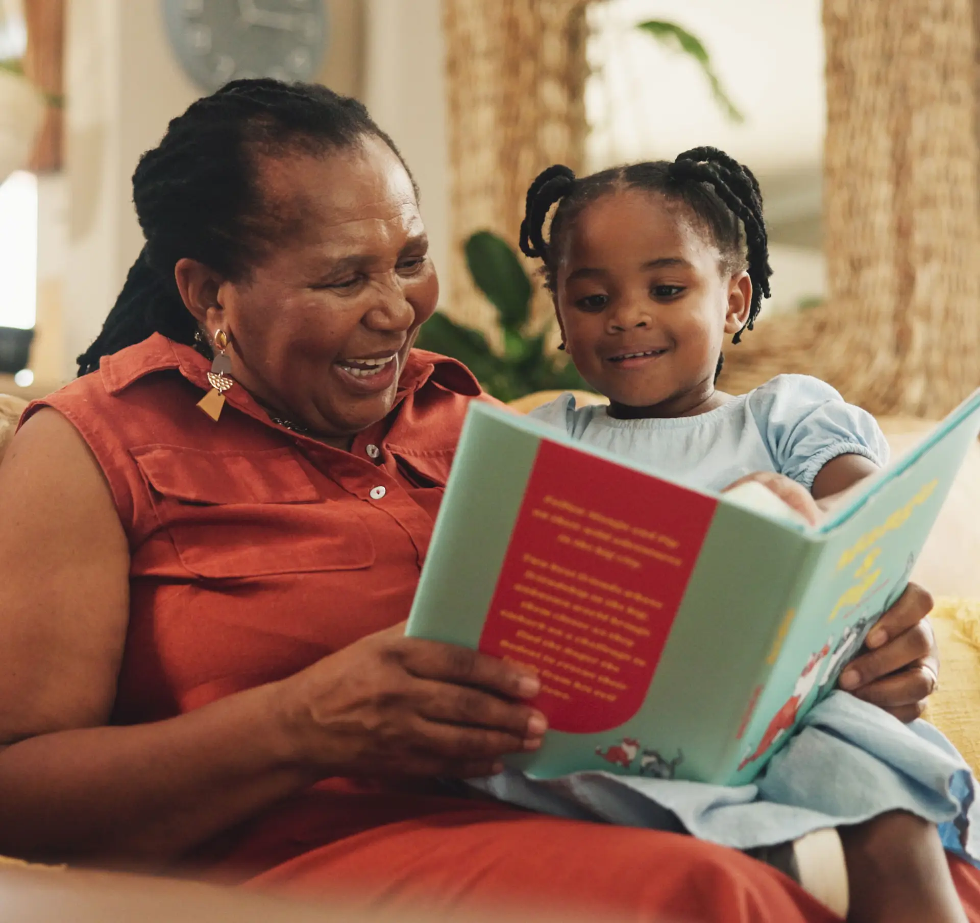 grandma reading book to grandchild
